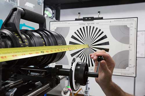 Camera tech calibrating camera